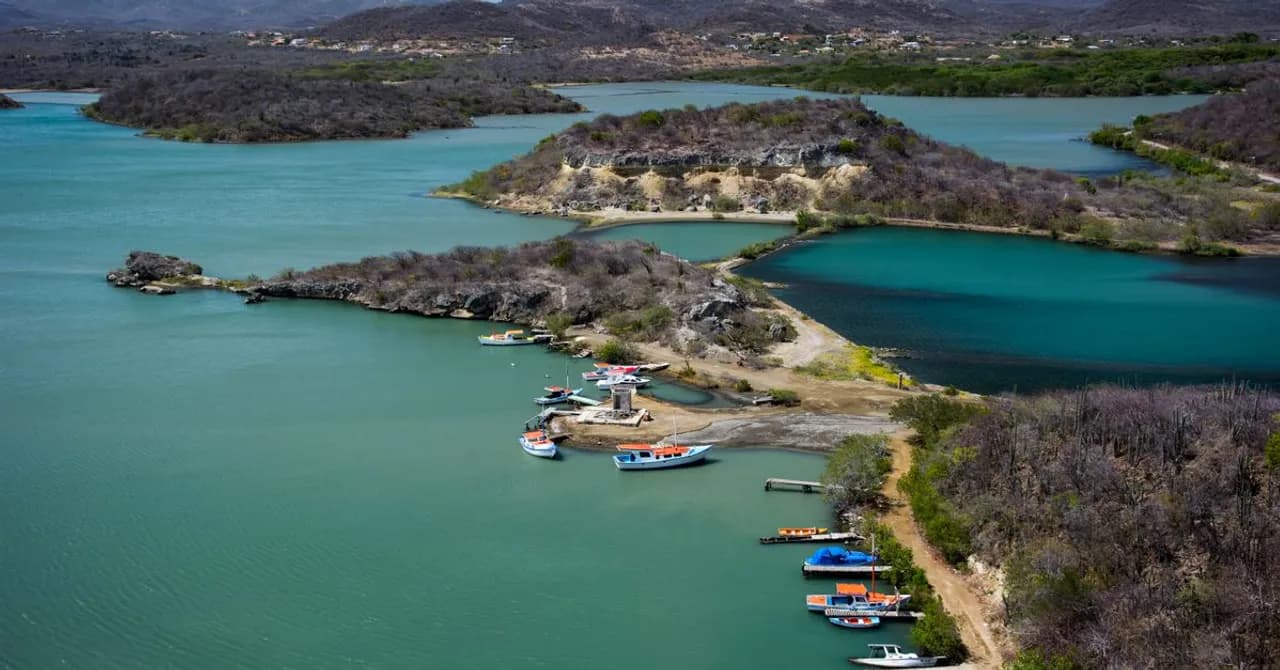 Colorful small boats moored in a turquoise Caribbean harbor