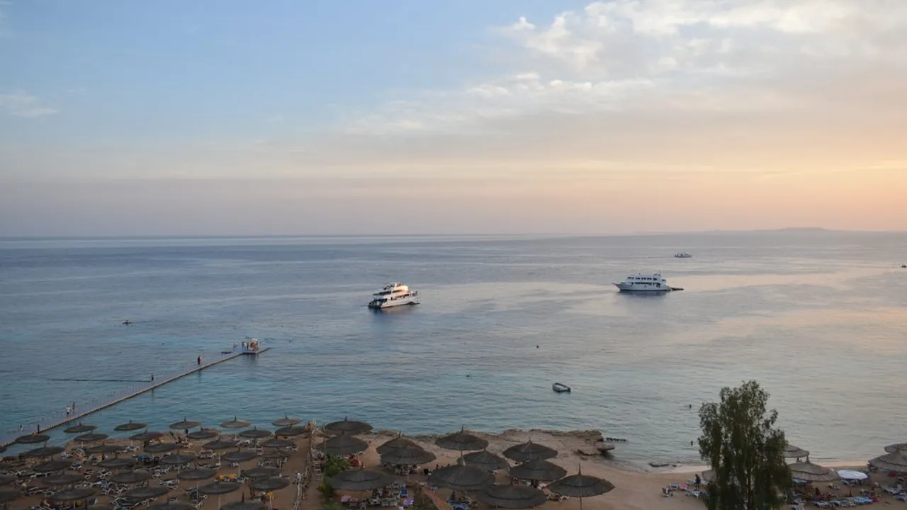 Aerial view of boats and beach umbrellas along the Red Sea shore at Sharm el-Sheikh