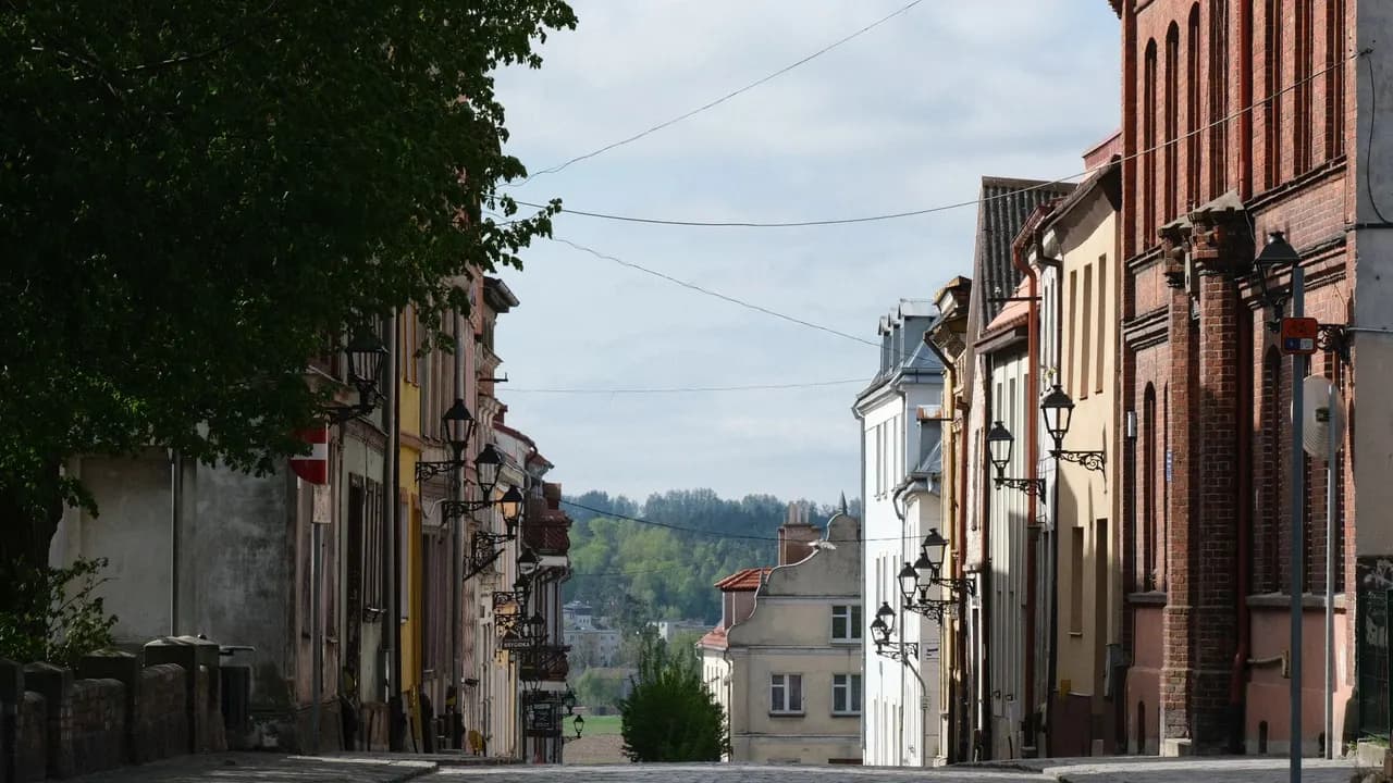 A cobblestone old-town street in a European city