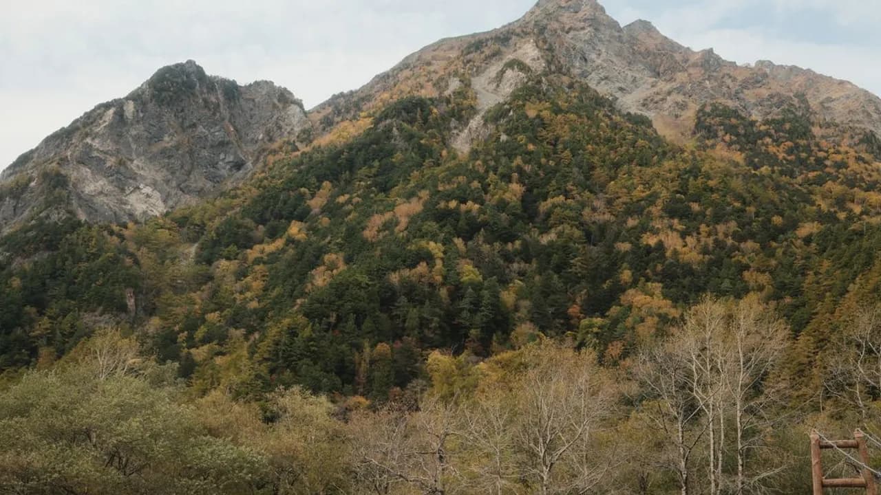 Mount Hotaka rising above autumn foliage in Nagano, Japan
