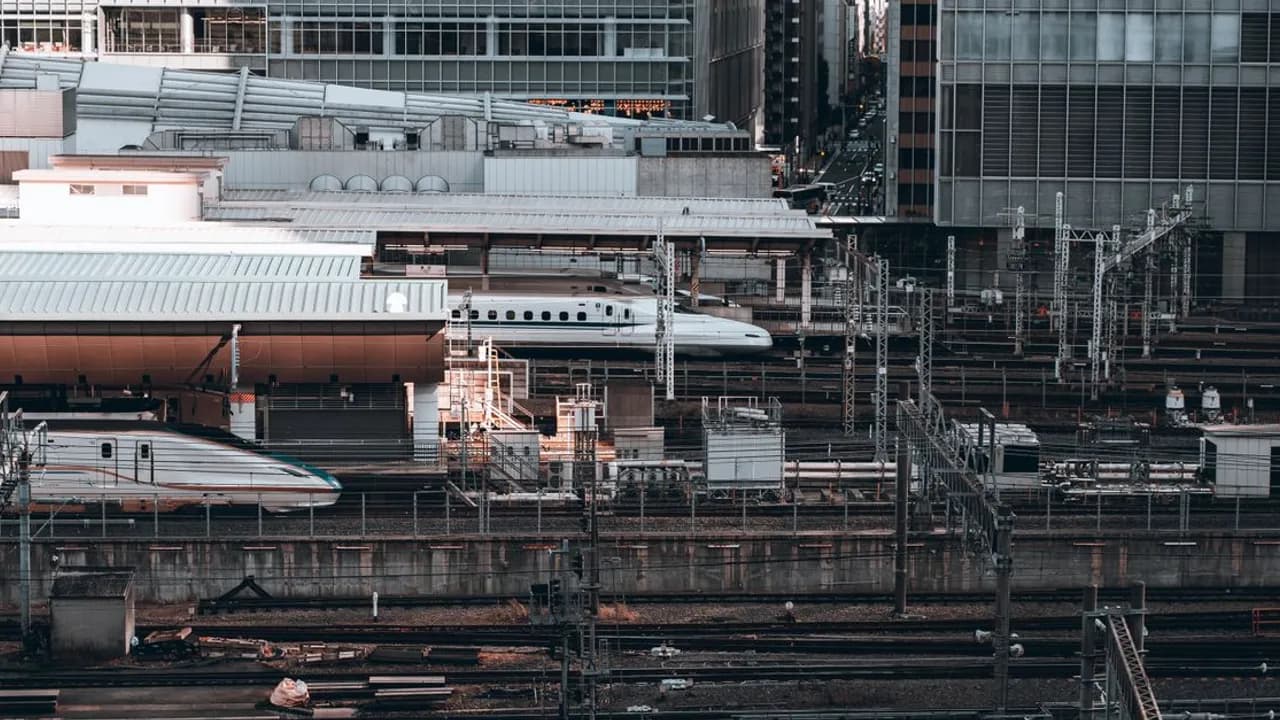 Aerial view of railway tracks converging on a station in central Tokyo