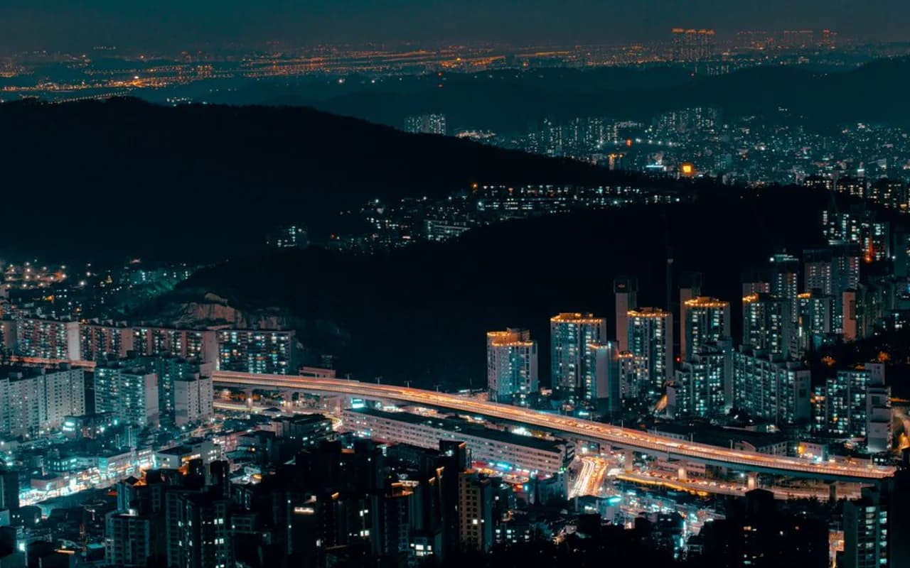 Aerial view of Seoul's illuminated skyline and highway at night