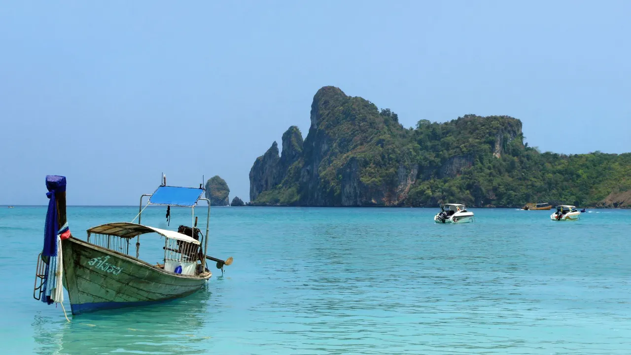 A long-tail boat off a Thai island beach