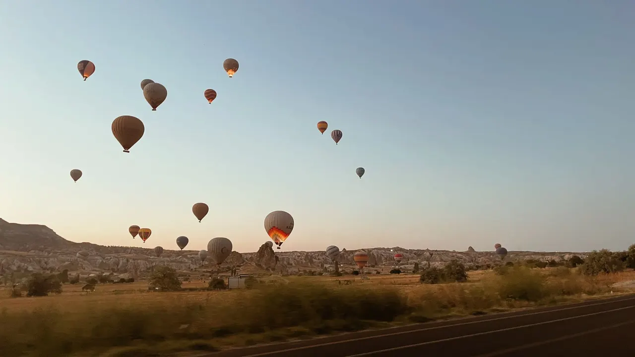 Hot air balloons rising over the valleys of Cappadocia, Turkey
