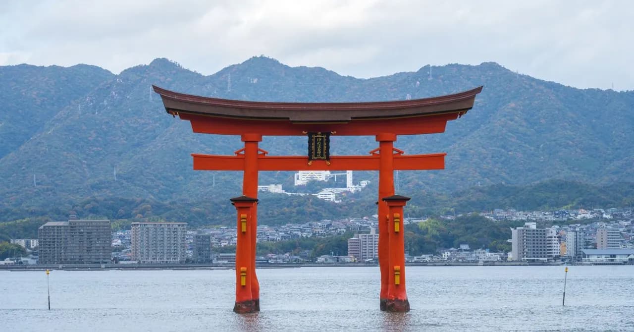 The floating torii gate at Miyajima standing in shallow water at high tide
